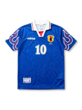 Front view of Japan 1997-98 home shirt with blue body, flame sleeve graphics, JFA crest, and #10 front number.