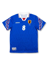 Front view of Japan 1997-98 home shirt with blue body, flame sleeve graphics, JFA crest, and #8 front number.
