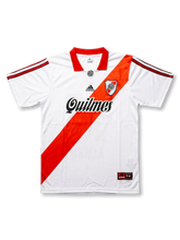 Front view of River Plate late 90s home shirt with white body, red diagonal sash, Quilmes sponsor, club crest, and red collar.