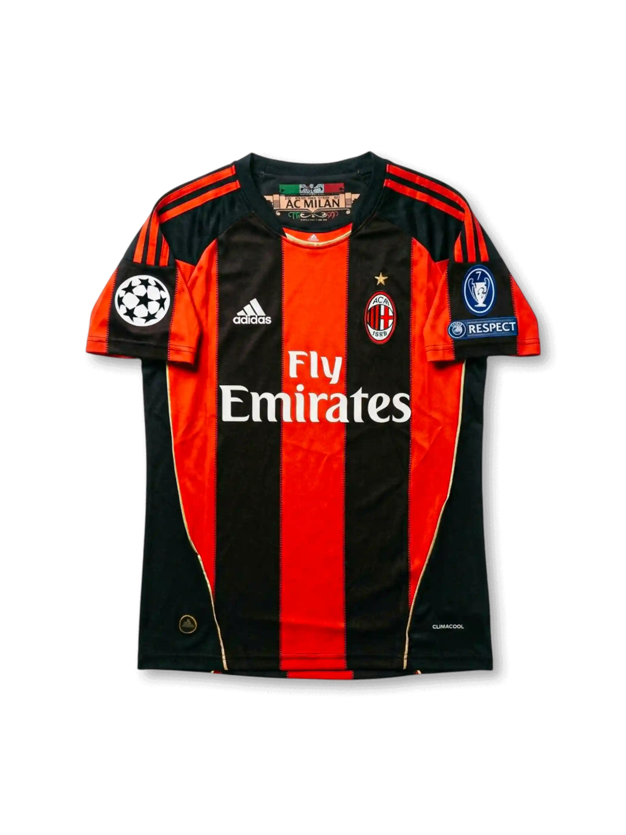 Front view of AC Milan 2010-11 Champions League home shirt with red and black stripes, Fly Emirates sponsor, AC Milan crest, and UEFA sleeve patches.