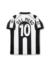 Front view of Juventus 1997-98 Champions League home shirt with black and white stripes, Sony MiniDisc sponsor, Juventus crest, Scudetto shield, and UEFA sleeve patch.
