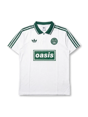 Front view of Adidas Originals x Oasis Live ’25 special edition polo shirt with white body, green stripes, trefoil logo, circular crest detail, and Oasis front branding.