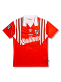 Front view of River Plate 1995-96 away shirt with red body, white shoulder striping, Quilmes sponsor, club crest, and Adidas detailing.