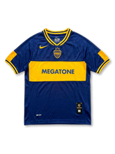 Front view of Boca Juniors 2001-02 home shirt with navy blue body, gold chest band, Megatone sponsor, Boca Juniors crest, and Nike detailing.