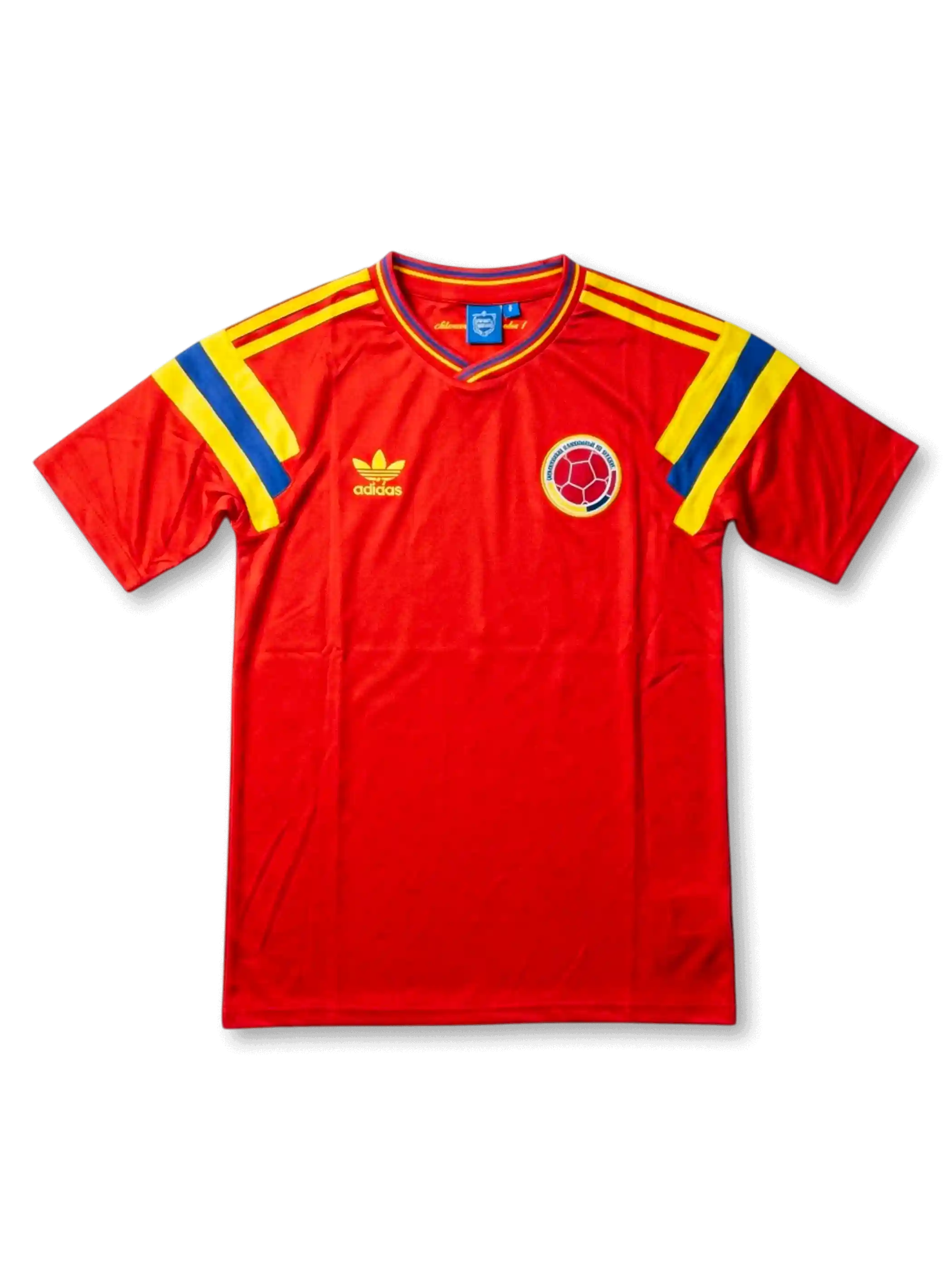 Front view of Colombia 1990 away shirt with red body, yellow and blue shoulder stripes, V-neck collar, and Colombia crest.