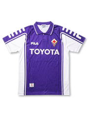 Front view of Fiorentina 1999-00 home shirt with purple body, white side panels, Toyota sponsor, and club crest.