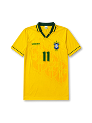 Front view of Brazil 1994 World Cup home shirt with yellow body, green collar trim, Brazil crest, #11 chest number, and tonal crest pattern.