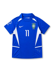 Front view of Brazil 2002 World Cup away shirt with blue body, white side panels, Brazil crest, #11 chest number, and Korea/Japan 2002 sleeve detail.