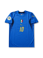 Front view of Italy 2006 World Cup home shirt with blue body, Italy crest, #10 gold chest number, dark side panels, and Germany 2006 sleeve patch.