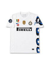 Front view of Inter Milan 2010-11 away shirt with white body, Pirelli sponsor, club crest, FIFA World Champions badge, Champions 2010 sleeve patch, and black-blue side graphic.