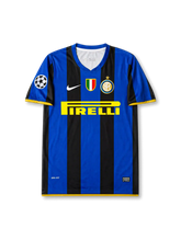 Front view of Inter Milan 2008-09 home shirt with black-and-blue stripes, Pirelli sponsor, Inter crest, Scudetto shield, yellow trim, and Champions League sleeve patch.