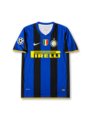 Front view of Inter Milan 2008-09 home shirt with black-and-blue stripes, Pirelli sponsor, Inter crest, Scudetto shield, yellow trim, and Champions League sleeve patch.