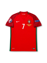 Front view of Portugal 2016 Euro Final home shirt with red body, Portugal crest, #7 chest number, Paris final embroidery, UEFA Euro 2016 patch, and Respect sleeve patch.