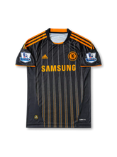 Back view of Chelsea 2010-11 away shirt with Drogba name set, #11 white print, black pinstripe body, orange sleeve trim, and Premier League sleeve patches.