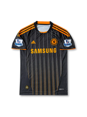 Back view of Chelsea 2010-11 away shirt with Drogba name set, #11 white print, black pinstripe body, orange sleeve trim, and Premier League sleeve patches.