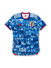 Front view of Japan anime collaboration #10 jersey in blue with manga panel graphics, Japan crest, red trim, and illustrated number detail.
