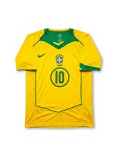 Front view of Brazil 2004 home jersey with yellow body, green chest panel, Brazil crest, and #10 front number detail.