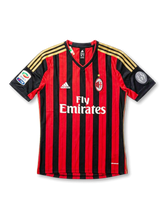 Front view of AC Milan 2013-14 home jersey with red and black stripes, gold shoulder details, club crest, sponsor, and sleeve patches.