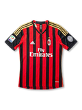 Front view of AC Milan 2013-14 home jersey with red and black stripes, gold shoulder details, club crest, sponsor, and sleeve patches.