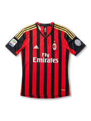 Front view of AC Milan 2013-14 home jersey with red and black stripes, gold shoulder details, club crest, sponsor, and sleeve patches.