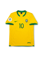 Front view of Brazil 2006 home jersey with yellow body, green trim, CBF crest, #10 front print, and Germany 2006 sleeve patch.
