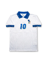 Front view of Italy 1994 World Cup away shirt with white base, blue collar, Italy crest, central #10 print, and geometric trim details.
