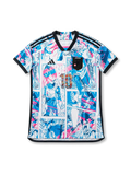Front view of Japan Dragon Ball Super collaboration shirt with all-over manga panel graphics, Japan chest patch, central #10 detail, and black trim.