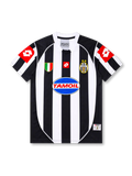 Front view of Juventus 2002-03 home jersey with black-and-white stripes, Tamoil sponsor, Scudetto shield, two-star crest, and red sleeve panels.