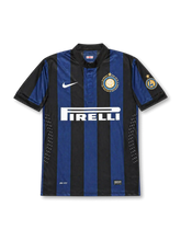Front view of Inter Milan 2007-08 home jersey with black and blue stripes, Pirelli sponsor, centenary crest detail, white swoosh, and Serie A sleeve patch.