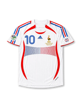 Front view of France 2006 World Cup Final away shirt with white base, red and blue panel design, France crest, central #10 print, final match embroidery, and Germany 2006 sleeve patch.