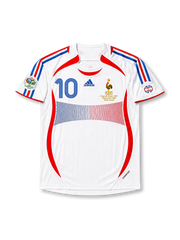 Front view of France 2006 World Cup Final away shirt with white base, red and blue panel design, France crest, central #10 print, final match embroidery, and Germany 2006 sleeve patch.