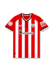 Front view of Athletic Club 2023-24 home shirt with red and white stripes, club crest, Kutxabank sponsor, Copa del Rey sleeve patch, and commemorative chest detail.