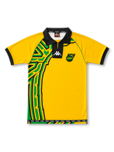 Front view of Jamaica 1998 World Cup home shirt with yellow base, black collar, Jamaica crest, green and black side graphic, and black sleeve cuffs.