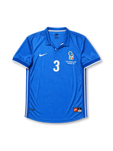 Front view of Italy 1998 World Cup home shirt with blue base, Italy crest, central #3 print, France 98 tournament detail, white sleeve trim, and polo-style collar.