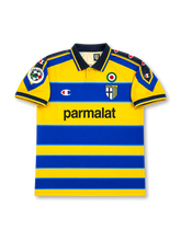 Front view of Parma 1999-00 home shirt with yellow and blue hoops, Parma crest, Parmalat sponsor, Scudetto badge, dark collar, and Lega Calcio sleeve patch.