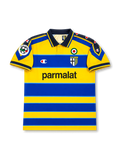 Front view of Parma 1999-00 home shirt with yellow and blue hoops, Parma crest, Parmalat sponsor, Scudetto badge, dark collar, and Lega Calcio sleeve patch.
