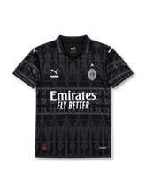 AC Milan special edition black jersey with tonal gothic graphics, polo collar, Puma logos, Emirates Fly Better sponsor, PLEASURES detail, and wefox back sponsor