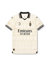 AC Milan special edition ivory jersey with tonal gothic pattern, black collar, Puma logo, PLEASURES detail, Emirates sponsor, and wefox back sponsor