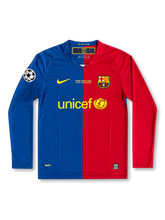 front view of Barcelona 2009 Rome Final home shirt with half blue and red design, UNICEF sponsor, club crest, final embroidery, and Champions League sleeve patch