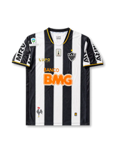 front view of Atletico Mineiro 2013 home shirt with black and white stripes, BMG sponsor, club crest, Lupo Sport branding, and Brazilian competition sleeve patch