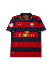 front view of Arsenal 2007-08 away shirt with red and navy hoops, Fly Emirates sponsor, Arsenal crest, gold Nike logo, and Champions League sleeve patch