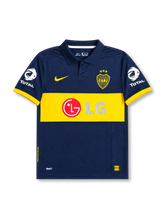 front view of Boca Juniors 2007 home shirt with navy body, yellow chest band, LG sponsor, Boca Juniors crest, Nike logo, and Total sleeve sponsors