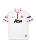 ront view of Manchester United 2012-13 away shirt with white body, red trim, Aon sponsor, club crest, Champions League patch, and UEFA Respect sleeve patch