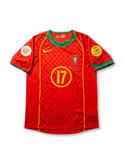front view of Portugal 2004 home shirt with red body, green collar, yellow number 17, Portugal crest, Euro 2004 patch, and UEFA Fair Play patch
