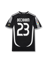 back view of Real Madrid 2006-07 away shirt with Beckham name, white number 23, black body, white curved side paneling, and La Liga sleeve patch