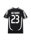Real Madrid 2006-07 away jersey featuring David Beckham #23, black adidas soccer shirt with white three-stripe shoulder detailing, curved white side panels, white-trimmed crew neck collar, BenQ Siemens sponsor logo, Real Madrid club crest, FIFA Best Club of the 20th Century commemorative badge, and BECKHAM name with white number 23 on the back.