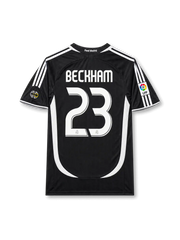 back view of Real Madrid 2006-07 away shirt with Beckham name, white number 23, black body, white curved side paneling, and La Liga sleeve patch