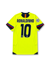 back view of Barcelona 2005-06 away shirt with fluorescent yellow body, navy trim, Champions League sleeve patch, and #10 Ronaldinho name and number print