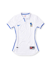 Italy 1998 away jersey, front view, white with blue side piping, fold-over collar with blue trim, blue Nike swoosh, FIGC crest with three stars, blue sleeve cuffs, Nike jock tag