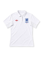 England 2010 home jersey, front view, all white with polo collar, red Umbro logo, Three Lions crest with Slovakia 2009 embroidery, ribbed sleeve panels